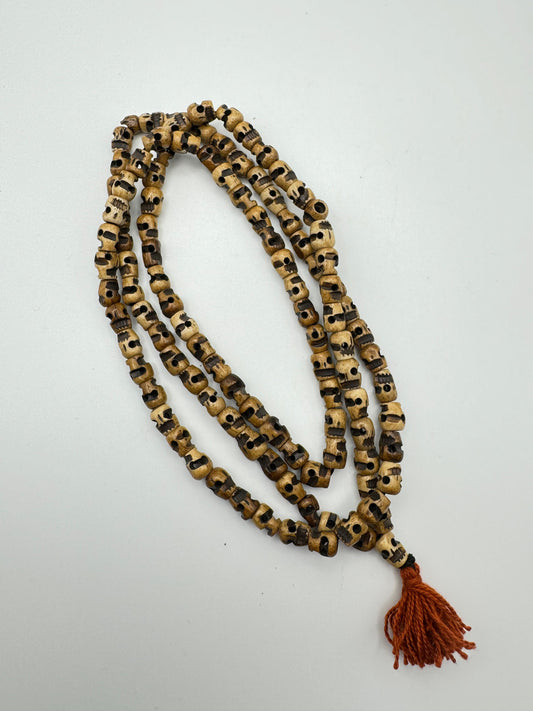 Brown Buddhist Skull Prayer Mala With Red Tassle